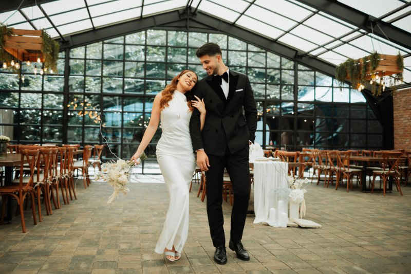 A couple walking together through their wedding venue